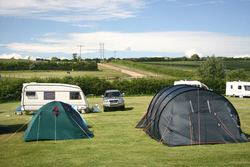 Image: Tents and caravans at Bagwell Farm Touring Park, Weymouth, Dorset